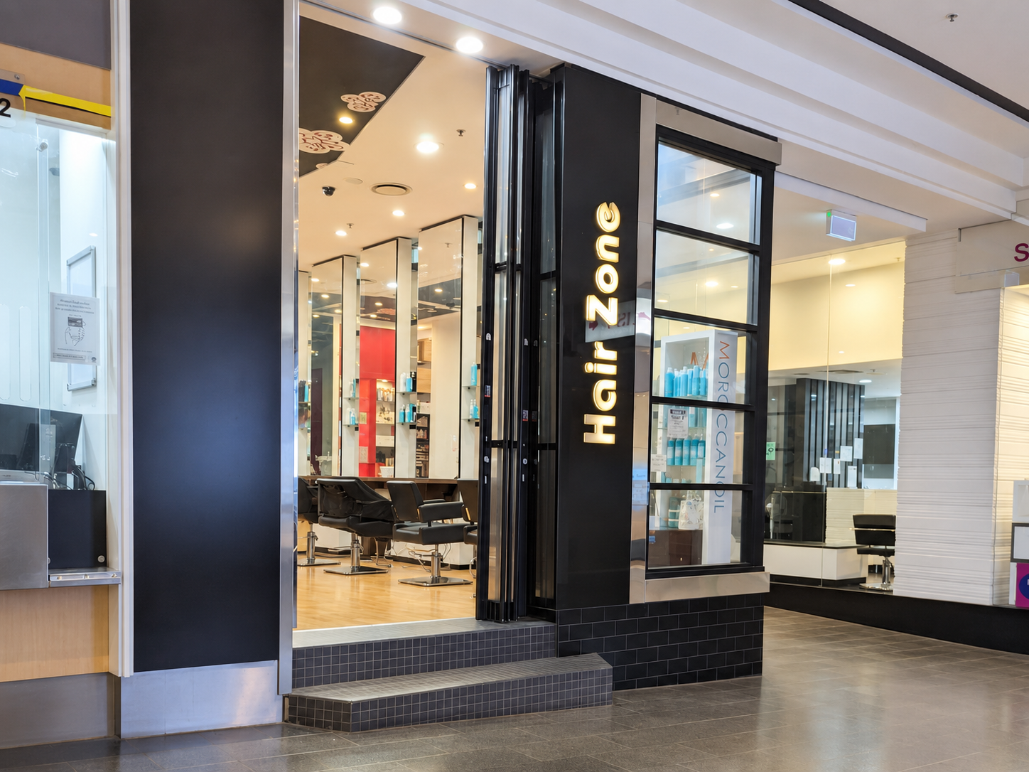 Hair Zone salon interior with mirrored styling stations
